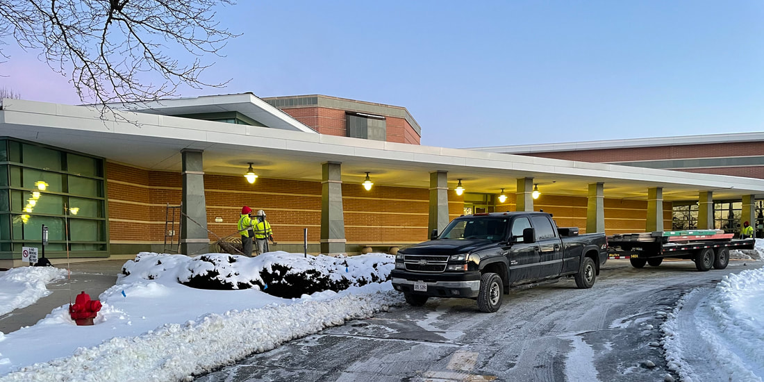 Construction crew arrives at the library on January 28.