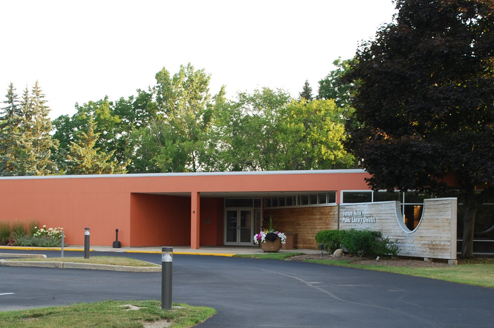 Photo of the library Annex, a small building behind the main library, which houses offices and meeting space